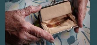 Consumer holding a purse containing coins